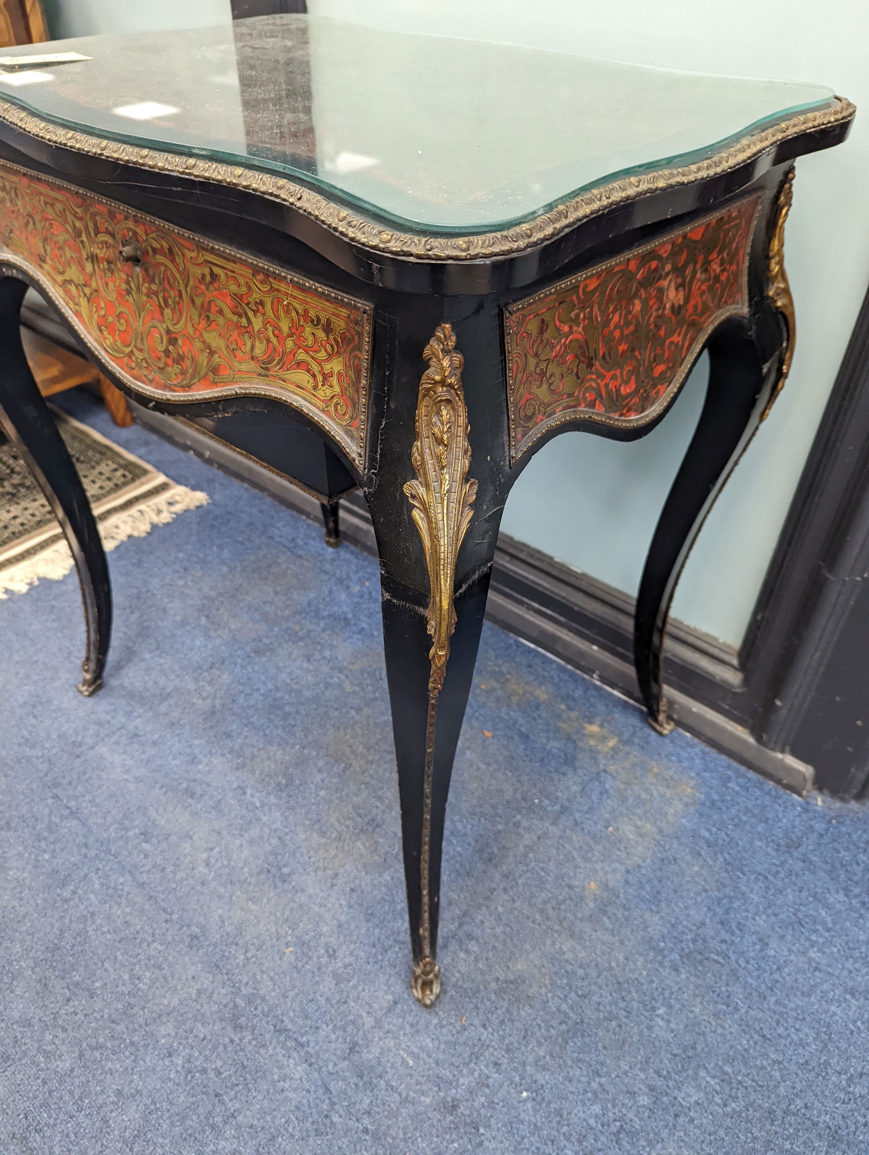 A 19th century French red Boullework poudreuse with mirrored internal lid and fitted interior, width 64cm, height 73cm